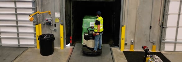 Worker transporting build materials and prefab manufacturing items